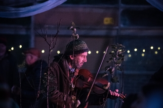 A man playing a fiddle