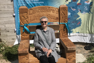 Hazel Ryan sitting on Lancashire Living Seas storytelling throne