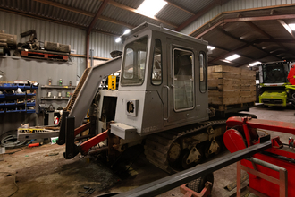 A custom bulrush harvester converted from an old apple harvester