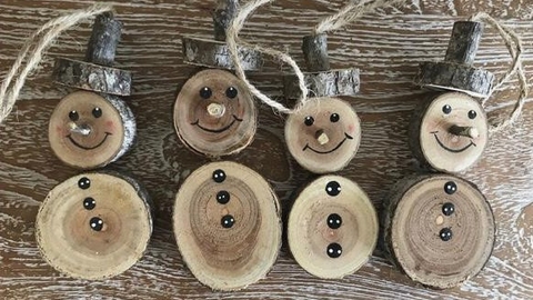 Snowman decorations made from log slices