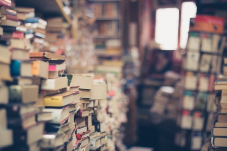 Piles of old books in an antique book shop