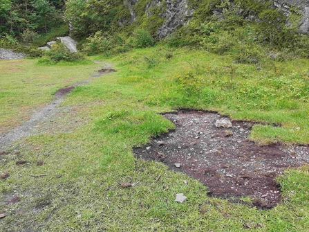 Area of bare earth that has been dug up to create mountain bike jumps