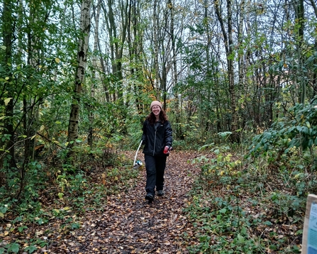 Volunteer litter picking in an area of woodland